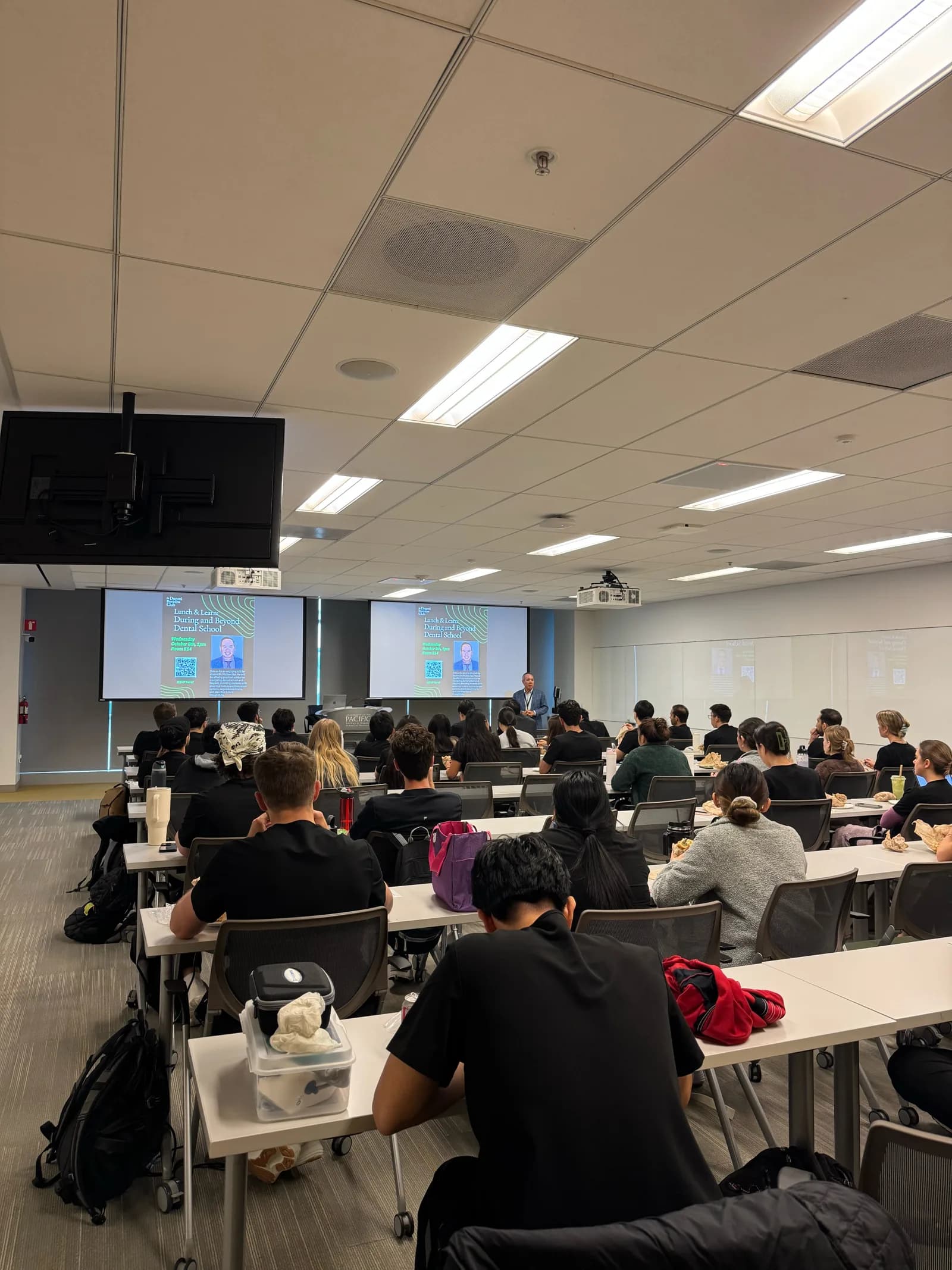 Dr. Michael Njo presenting to Dugoni students during a Lunch & Learn session