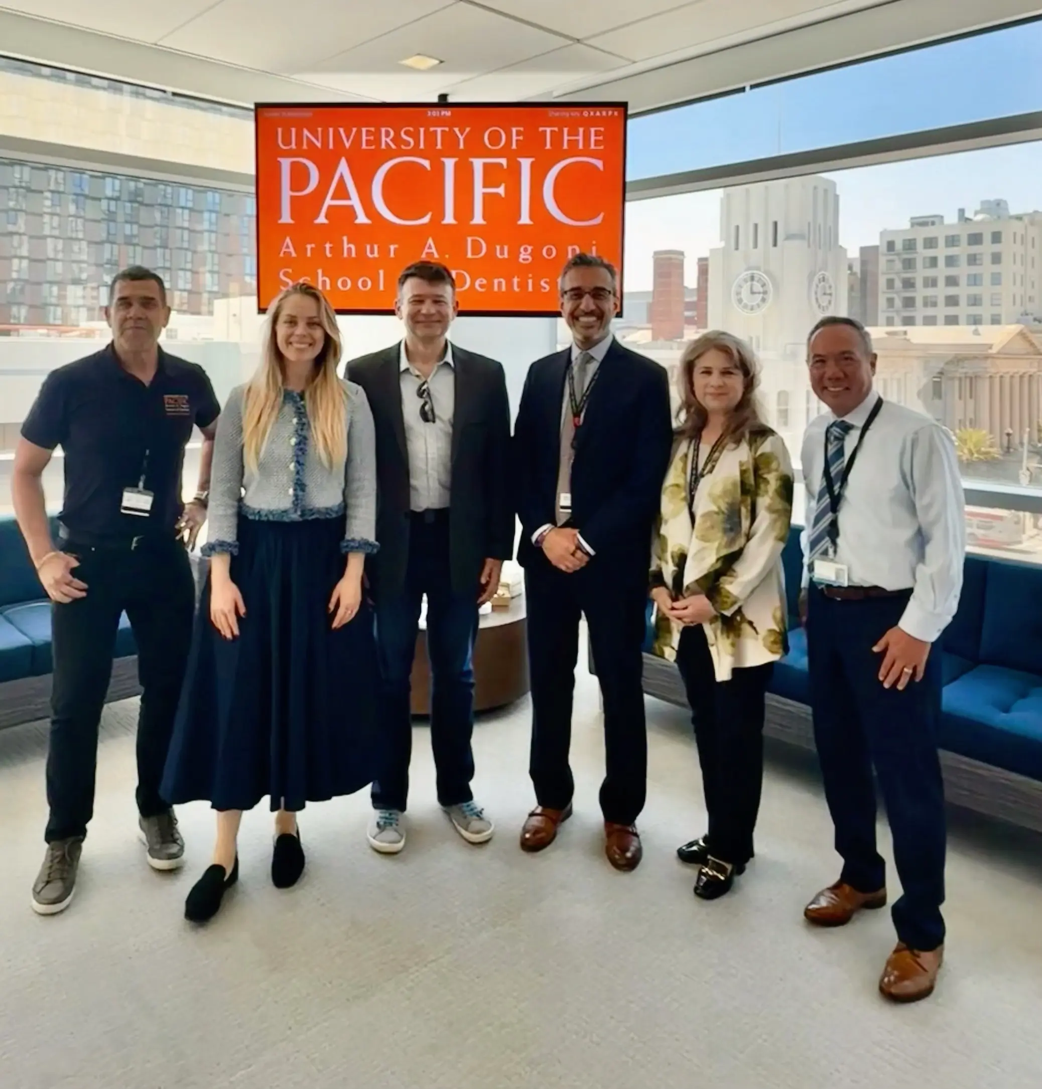 Dr. Michael Njo with Dean Nadershahi and Interim Dean Chavez beneath the University of the Pacific Arthur A. Dugoni School of Dentistry banner