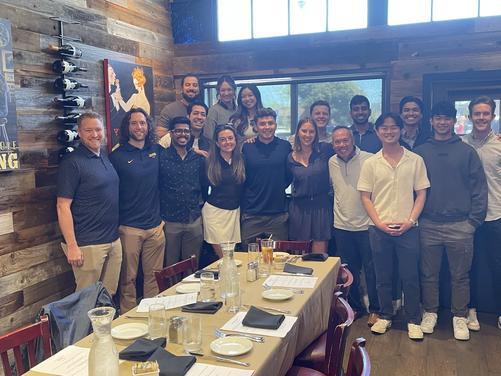 Dr. Michael Njo with a large group of Dugoni Business Club members at a celebration lunch